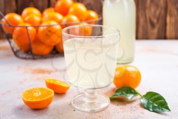 Fresh tangerines and tangerine juice. Healthy food. Stock photo