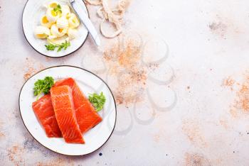 salmon fish and butter on a table, stock photo