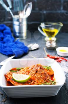 fish with tomato sauce and aroma spices, stock photo