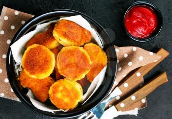 nuggets with tomato sauce on plate , stock photo