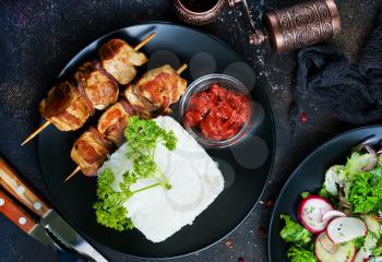 kebab with boiled rice on plate, stock photo