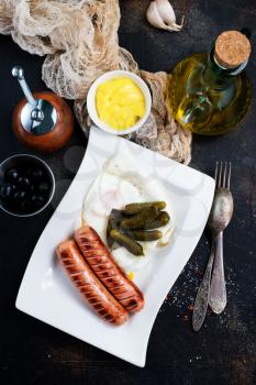 fried sausages, sausages on white plate, stock photo