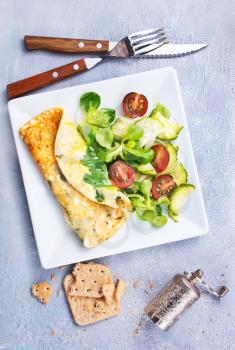 omelette with vegetable salad on the plate, stock photo