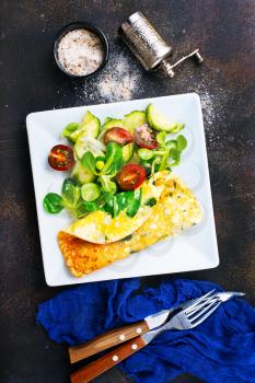omelette with vegetable salad on the plate, stock photo