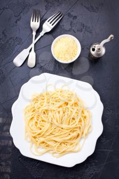 Spaghetti or pasta is homemade Italian traditional food. Cooked pasta on table.