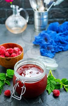 homemade jam in bank and fresh berries