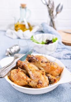 baked chicken legs with spica and fresh salad