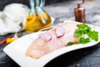 raw chicken fillet with salt and aroma spice