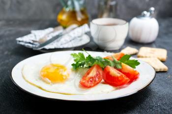 breakfast on plate, fried eggs with vegetables