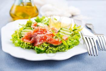 fresh salad with salmon on plate, diet food