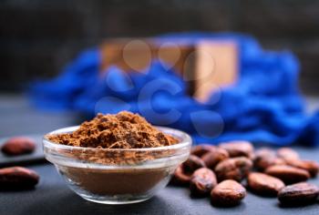 cocoa beans and cocoa powder on a table