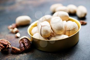 Pecan nuts in metal bowl, pecan nuts in shell