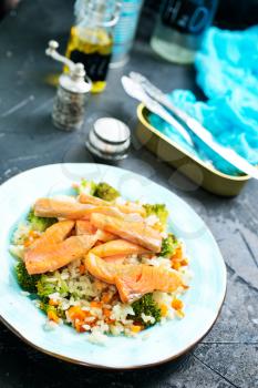 fried salmon with boiled rice and broccoli