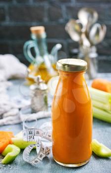vegetable smoothie in bottle on a table