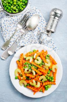 salad with fresh vegetables. salad with celery carrot peas