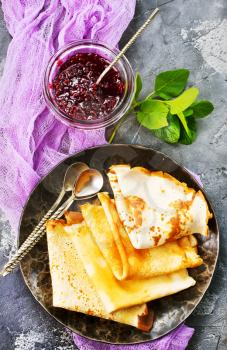 sweet pancakes with jam on the plate