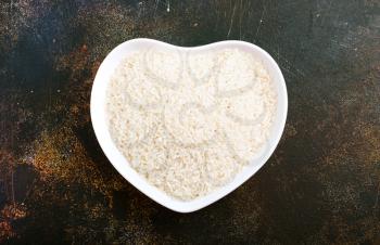 raw rice in bowl plate, rice in heart-shaped bowl