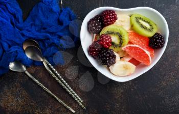 salad with fresh berries and fruits in bowl