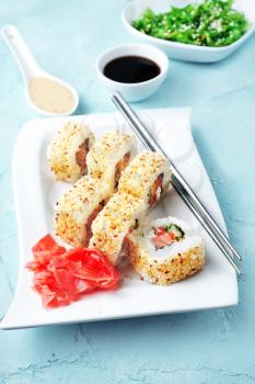 Delicious sushi rolls with rice, chuka and sauce