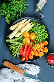 fresh vegetables, raw vegetables on black plate