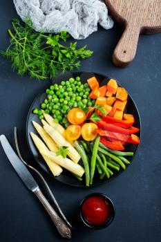 fresh vegetables, raw vegetables on black plate
