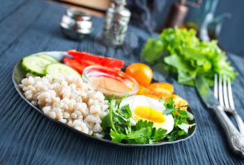 fresh ingredients for salad: bulgur and vegetables