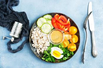  Bulgur porridge egg and fresh vegetables. Diet menu. Diet food