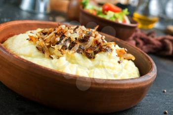 mashed potato with fried onion in bowl