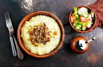 mashed potato with fried onion in bowl