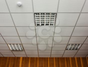 White office ceiling with built-in fluorescent lamps