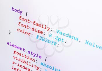 Web design CSS source code closeup diagonal view, monitor screenshot