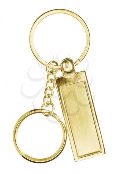 Hanging golden key chain with scratches with chain and rings isolated on white background