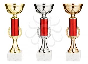 Gold, silver and bronze winners trophy cup isolated on white background