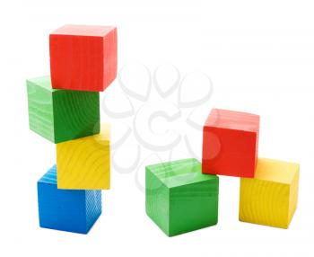 Wooden colored cubes tower toys isolated on white background