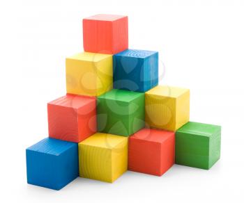 Wooden colored building pyramid of cubes toys isolated on white background