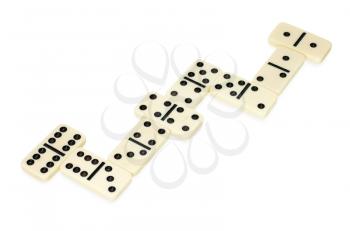 dominoes lying on the table in snake shape isolated on white background
