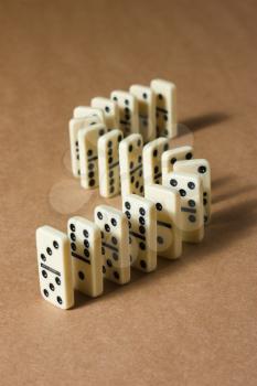 White dominoes on a brown textured background
