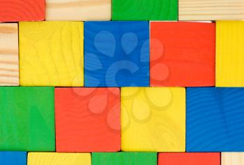 Colourful wall from toys wooden cubes background