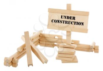 Under construction unfinished wooden house isolated on white
