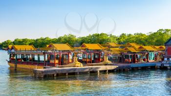 Traditional Chinese boats on Kunming Lake at the Summer Palace in Beijing