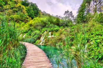 Wooden pathway above water at Plitvice National Park. UNESCO world heritage in Croatia