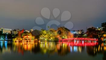 The Huc Bridge leading to the Temple of the Jade Mountain on Hoan Kiem Lake in Hanoi at night. Vietnam