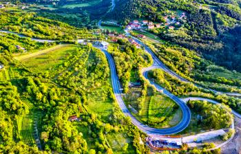 Aerial view of a winding road in the Dinaric Alps, Slovenia