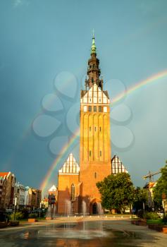 St. Nicholas Cathedral with a double rainbow in Elblag, Poland