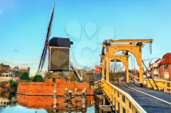 Molen De Put mill and the Rembrandt Bridge in Leiden - South Holland, the Netherlands
