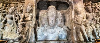 Trimurti Sadashiva sculpture in the cave 1 on Elephanta Island. Mumbai - Maharashtra, India
