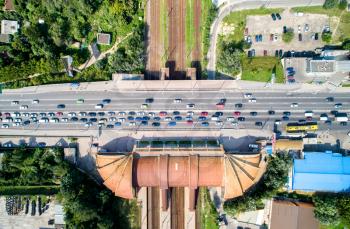 Top-down view of a road bridge crossing a railway. Karavaevi Dachi station - Kiev, Ukraine