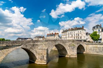 Old stone bridge across the Mayenne River in Laval - Pays de la Loire, France