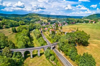 Aerial view of an old railway viaduct in Cleron, a village in the Doubs department of France