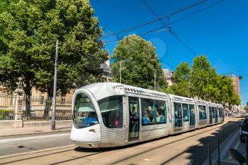 Lyon, France - July 11, 2018: Alstom Citadis 302 tram at Rue Servient in Lyon. Lyon's tram networks consists of 6 lines with 96 stations.